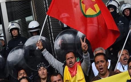 Protesters wave a flag of Kurdistan Workers' Party at the European parliament in Brussel, AFP photo.