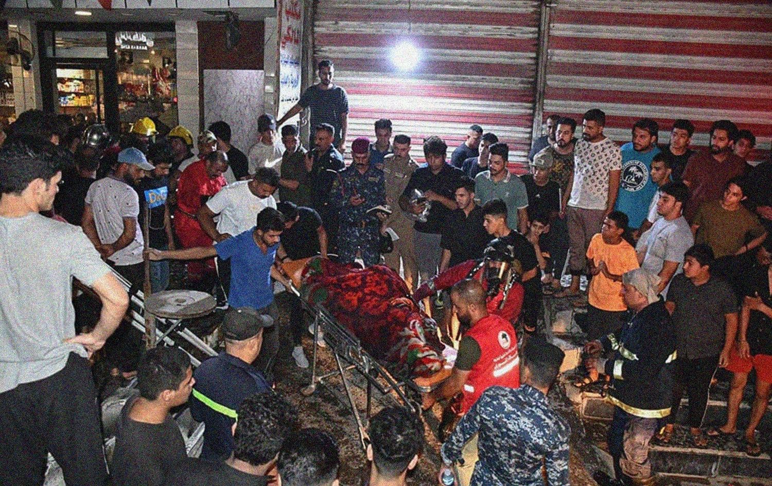 Civil defense teams retrieve bodies from a fire that engulfed a bakery in Baghdad's Sadr city on August 16, 2023. Photo: General Civil Defense Directorate/Facebook