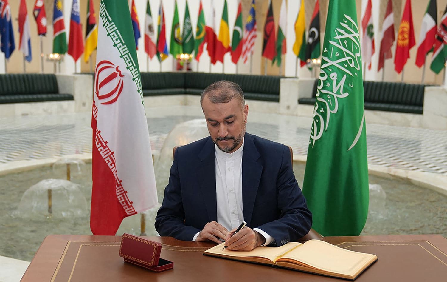 This handout picture provided by the Iranian foreign ministry shows Iran's Foreign Minister Hossein Amir-Abdollahian signing a book following a meeting with his Saudi counterpart in Riyadh on August 17, 2023. Photo: handout/Iranian foreign ministry/AFP