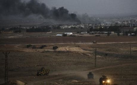 Smoke rises over Kobane, seen from the Turkish border on Friday. Photo: AFP.