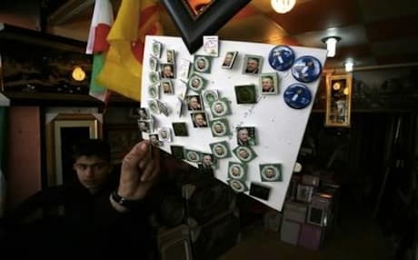 A street vendor in Sulaimani sells pins with pictures of PUK leader Jalal Talabani and head of the Gorran Movement Nawshirwan Mustafa. Photo: AFP