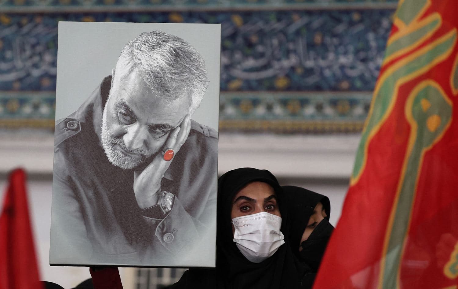 An Iranian woman carries the portrait of Iran's slain commander Qasem Soleimani in Tehran on January 3, 2023. Photo: AFP