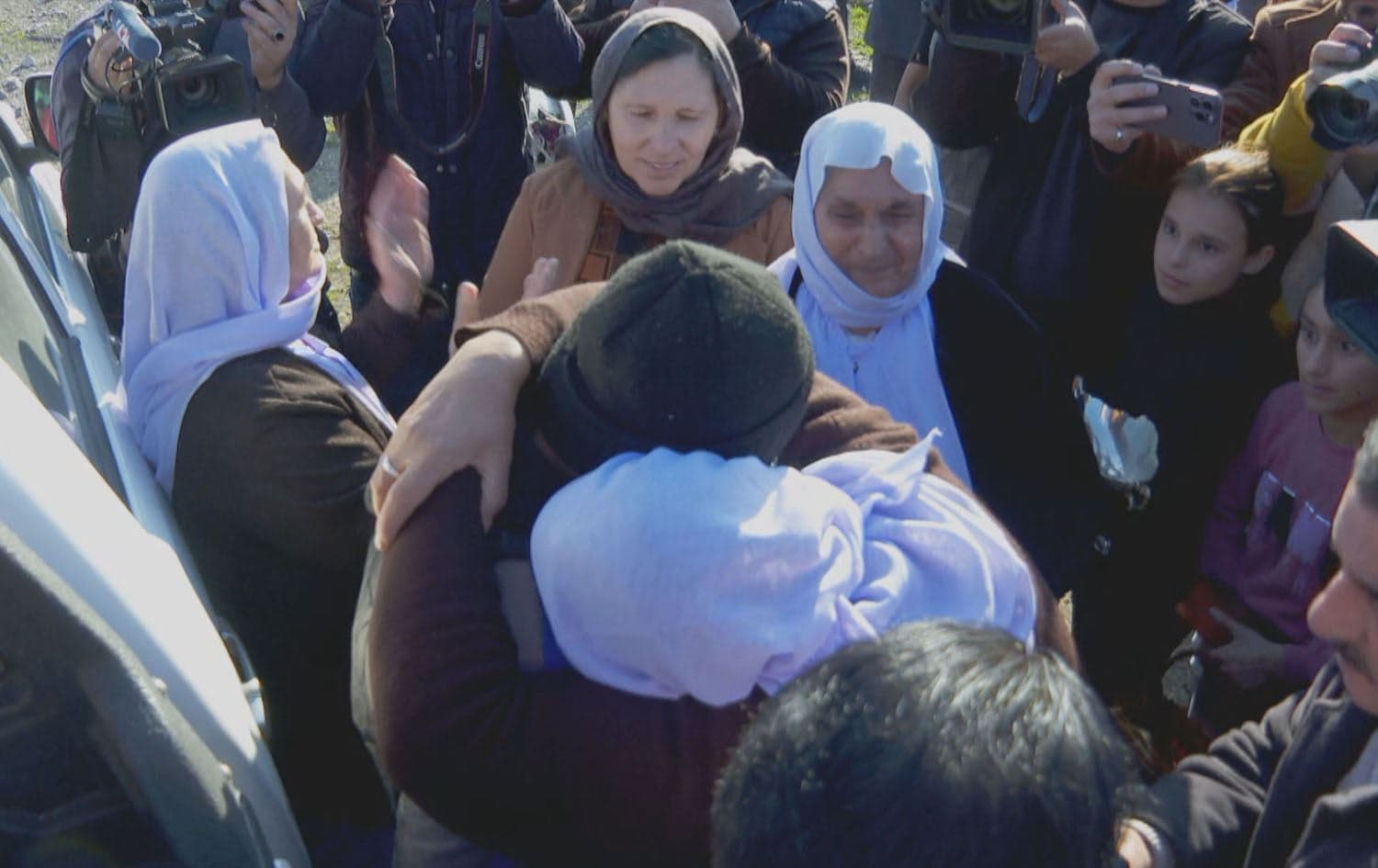 19-year-old Yazidi youth rescued from a decade of ISIS captivity arrives in Chamishko camp in Zakho on 25 December 2023, where he is greeted by relatives and camp residents. Photo: Rudaw/Screengrab