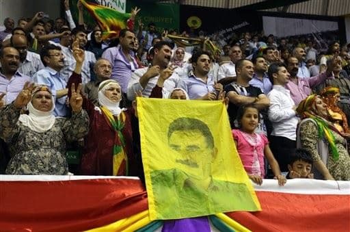 PKK supporters in Turkey hold up a portrait of their jailed leader Abdullah Ocalan. Photo: AP