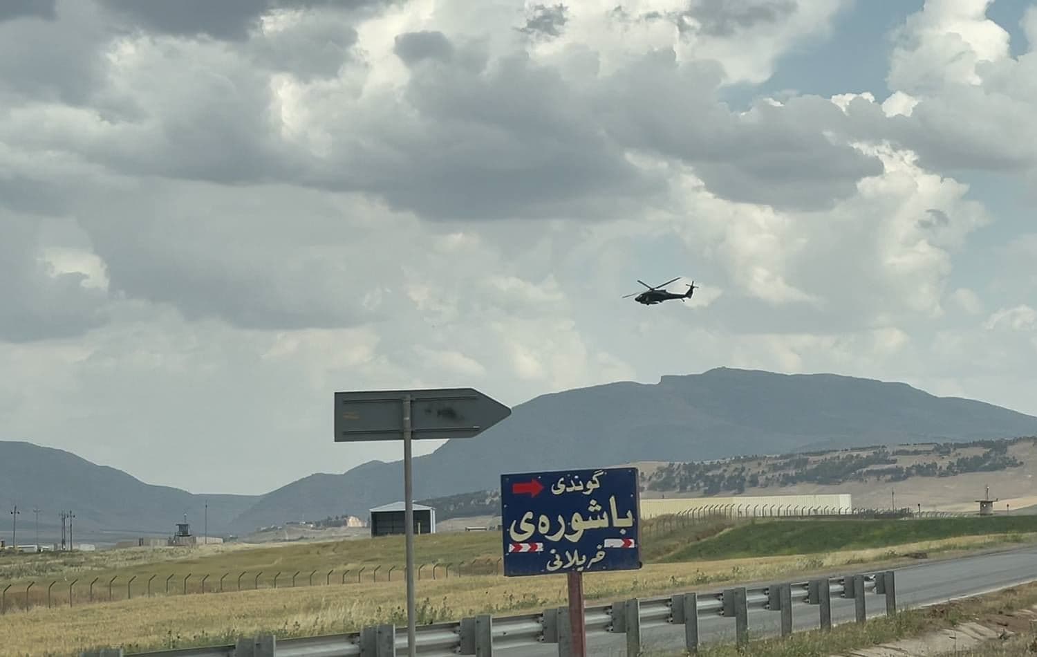 A helicopter flies over Harir air base in Erbil province in May 2021. Photo: Rudaw