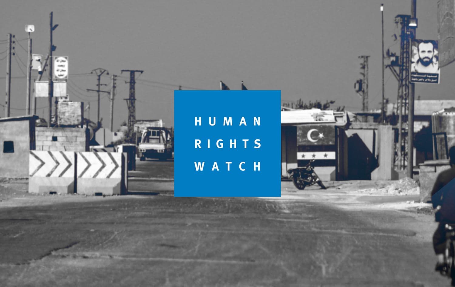 Human Rights Watch logo. Graphic: Rudaw. A checkpoint for the Turkish-backed Syrian National Army (SNA) in northwestern Syria. Photo: AFP