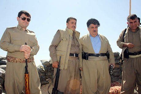 Atta Haji Mahmoud (first left) and his father Hamay Haji Mahmoud (second right) on the frontlines near Kirkuk. Photo: Rudaw