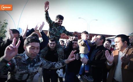 Relatives welcome home Peshmerga fighters from Kobane.