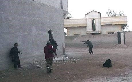 Islamic State gunmen in action in Kobane. AP photo.