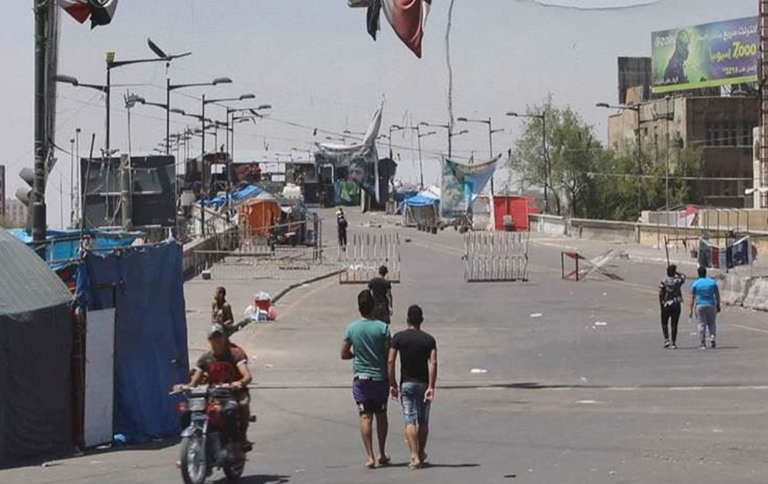 دیمەنێک لە شەقامێکی شاری بەغدا