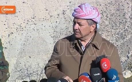 Barzani speaking to reporters on Mount Shingal.