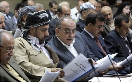 Members of the Kurdish parliament read a draft of the proposed new constitution, June 2009. Photo: AP
