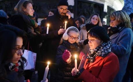 A candlelight vigil in Paris for victims of the attack. AFP photo.