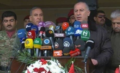 Nujaifi (right) and Obaidi speak to reporters at the front.