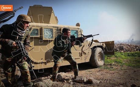 Peshmerga forces attacking ISIS militants at Sultan Abdullah village near Gwer, December 2014.