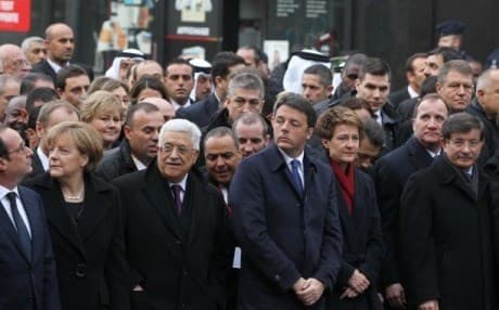 Davutoglu (extreme right) with other world leaders at the Paris march. AA photo.