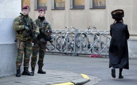 Belgian paramilitary commandos on patrol near a synagogue in the city of Antwerp on Saturday. AP photo. 