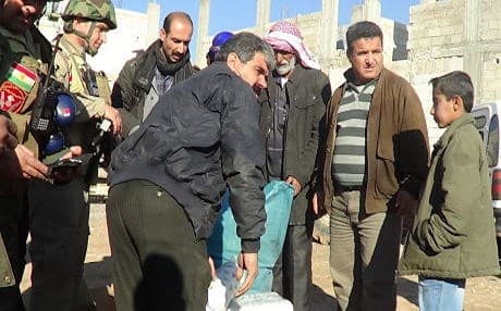 Peshmerga soldiers with some of the remaining residents of Kobane. Photo: Rudaw.