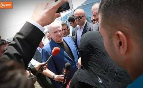 Ahmad Chalabi visiting a refugee camp in Kurdistan last June. 