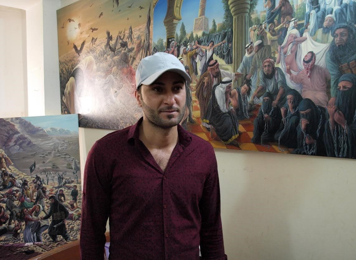 Yezidi painter Ammar Salim in the studio. Photo: Judit Neurink.