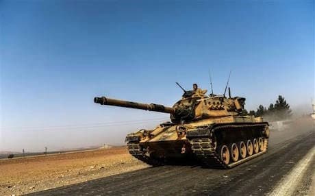 A Turkish army tank drives towards Syria in the Turkish border city of Karkamis . Photo: AFP