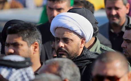Qais Al-Khazal (centre), the leader of the Shiite militia of Asa’ib Ahl al-Haq attends funeral procession of six members of his militia who were killed in Tikrit fighting ISIS. AP photo