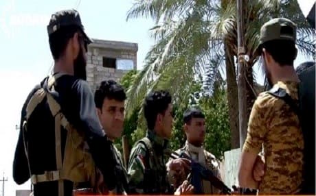 Kurdish Peshmerga and Shiite Hashd al-Shaabi seen together in the town of Tuz Khurmatu in an effort to jointly patrol the city after days of clashes, 2015. Rudaw photo