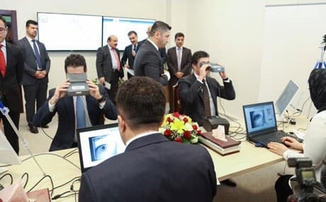 Prime Minister Nechirvan Barzani (R) and Deputy Prime Minister Qubad Talabani (L) were among the first government employees to be registered in the new system. Photo: Rudaw