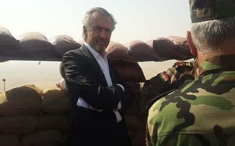 French writer and philosopher Bernard-Henri Levy standing in the frontline against ISIS with members of the Kurdish Peshmerga forces during the making of his film. Photo courtesy of BHL