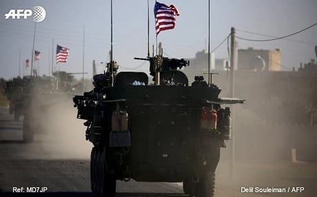 US forces stepped up their visible presence in northern Syria around Manbij earlier this month. Images show the US forces moving in the Manbij area, flying American flags. Photo: Delil Souleiman/AFP