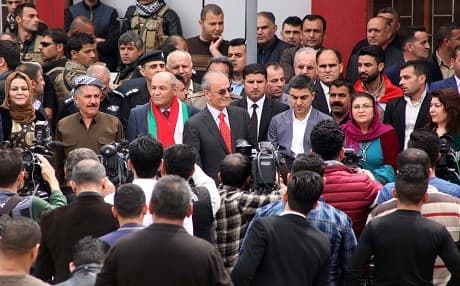 Kirkuk provincial Governor, Najmadin Karim (C), speaks to the press after a ceremony to raise the Kurdistan flag next to an Iraqi flag over a government building in Kirkuk on March 28, the day the flag was officially hoisted over state buildings. Photo: AFP/Marwan Ibrahim