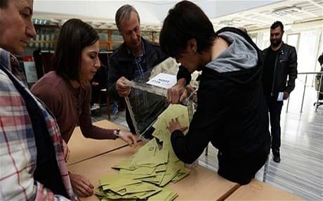 Ballots are poured out at a polling station in Turkey. Photo: AP