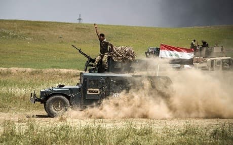 A member of the Iraqi Security Forces gestures as they advance against the ISIS militants in Mosul offensive that was launched by a joint Iraqi and Kurdish forces, backed by the US-led Global Coalition since last October. File photo: AFP