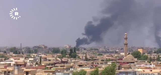 Large plums of smoke rise from embattled the Zanjali neighborhood of Old Mosul where ISIS is still in control.