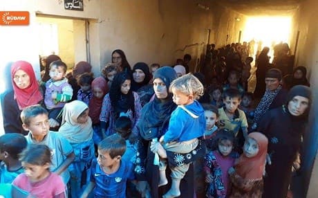 Displaced Iraqis await to be transferred to camps behind Kurdish Peshmerga lines. Photo: Rudaw