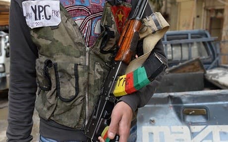 A YPG fighter in Aleppo’s Sheikh Maqsoud neighbourhood. Photo: Miguel Medina/AFP/file