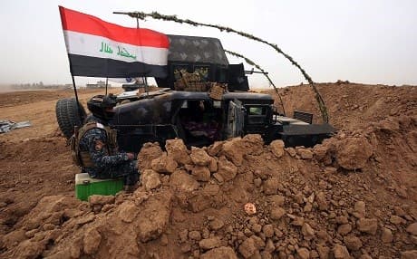 Iraqi forces gather at their camp on the front line in the northwestern town of Fishkhabur, near the borders with Syria and Turkey, on October 28, 2017. Photo: AFP / Ahmad al-Rubaye