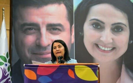 Serpil Kemalbay, speaks in front of the banner of the jailed HDP's co-leaders Figen Yuksekdag and Selahattin Demirtas, after she was elected as the party's new co-leader in Ankara in May 2017. File photo: AFP/STR