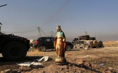 A statue of Virgin Mary is placed in a street in the Christian town of Bartella, 15 kilometers east of Mosul in October 2016. Photo: AP/Khalid Mohammed