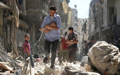 Syrian men cradle babies as they navigate the rubble of destroyed buildings after an air strike on Aleppo’s Salihin district in September 2016. Photograph: Ameer Alhalbi/AFP