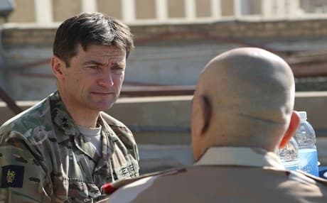 British Army Maj. Gen. Felix Gedney speaks with Iraqi security force Staff Lt. Gen. Wa’ad Zainl Saleh, senior secretary to the Iraqi chief of defense, during a High Level Committee lunch in Baghdad on December 5. Photo: Sgt. Von Marie Donato | US Army