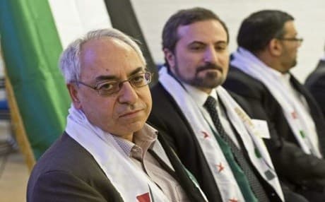 Abdulbaset Sieda (left) and an unidentified member of the oppositional Syrian National Council attend a meeting in the Stockholm suburb Hasselby, on August 31, 2012. Photo: Leif R. Jansson | AFP