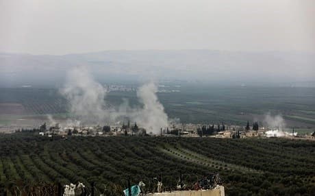 A picture taken on February 10, 2018 from the Syrian village of Atme in northwestern Idlib shows smoke plumes rising in the village of Deir Ballut in Afrin. Photo: Omar Haj Kadour | AFP
