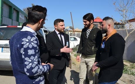 A graduate of an anti-jihadist ideology course organised by the Muslim Scholars Forum of Mosul speaks to new volunteer recruits after his ceremony on February 8, 2018. Photo: Ahmad Muwafaq | AFP