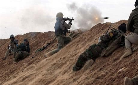 Hashd al-Shaabi paramilitary fighting ISIS militants in a village, west of the city of Mosul, northern Iraq. Photo: Ahmad Al-Rubaye | AFP/File