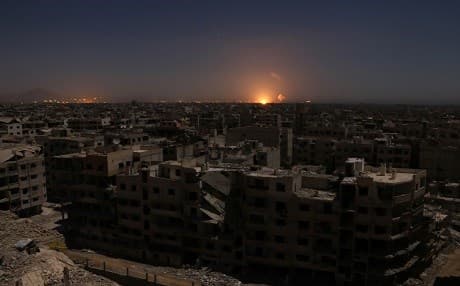 Al-Ghutah, Syria : Flames following a reported rocket attack is seen on the horizon in the rebel-held enclave of Eastern Ghouta on February 28, 2018. / AFP / Mohammed EYAD
