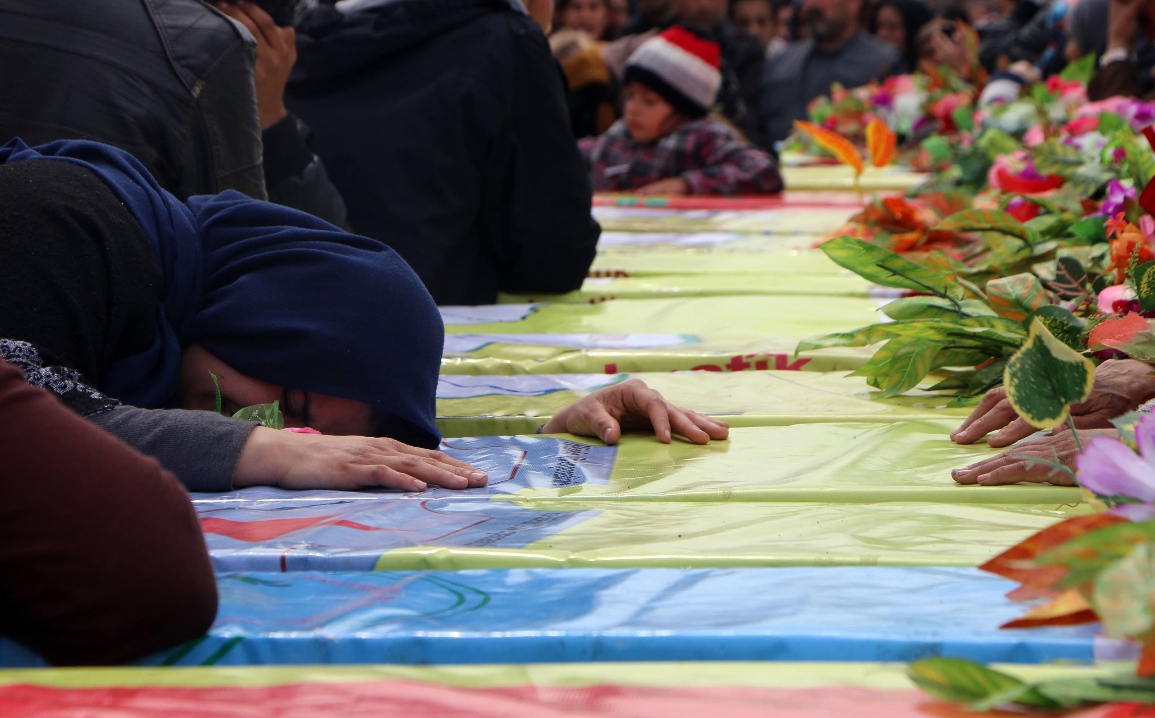 Kurds in Afrin mourn during the funeral on March 1 of fighters from the People's Protection Units (YPG) and the Women's Protection Units (YPJ). Photo: Ahmad Shafie Bilal/AFP