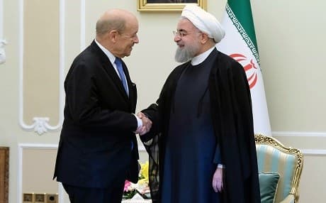 Iranian President Hassan Rouhani welcomes France's Foreign Minister Jean-Yves le Drian to Tehran on March 5, 2018. Photo: Iranian presidency via AFP