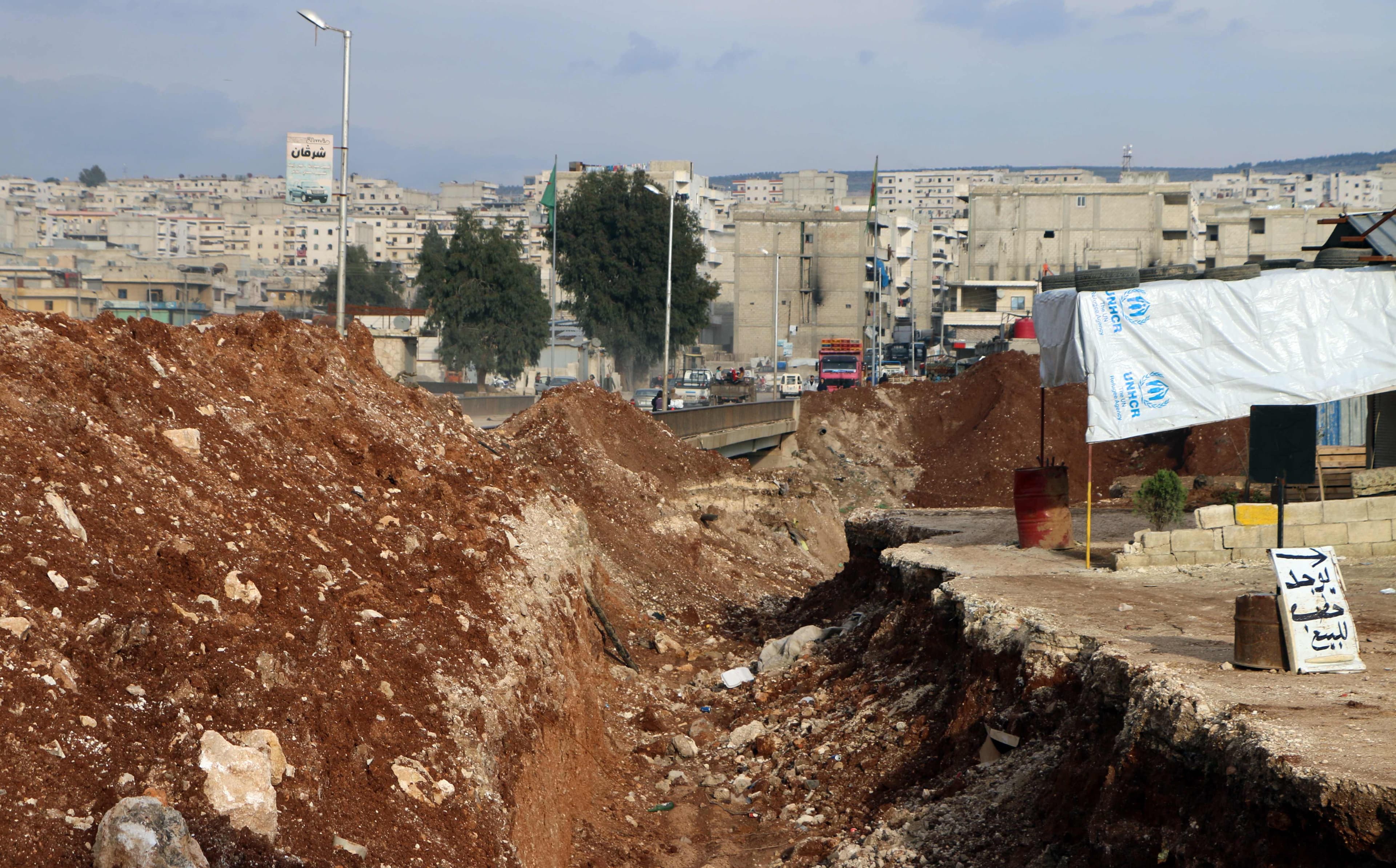 Forces in Afrin have prepared the city for a Turkish ground offensive, including this trench pictured on March 2. Photo: Ahmad Shafie Bilal/AFP