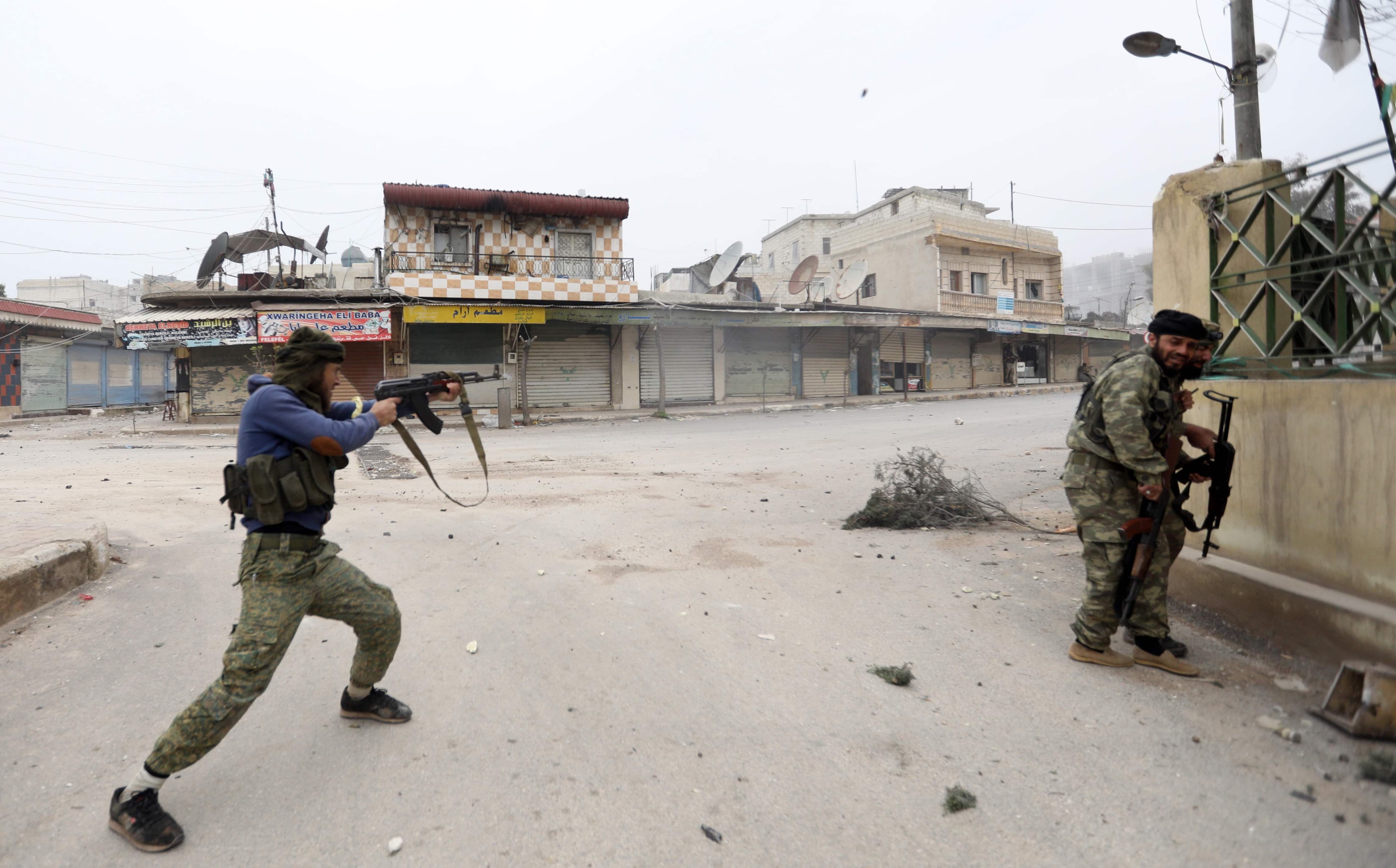 Turkish-backed Syrian rebels advance in Jandaris on Thursday. Photo: Omar Haj Kadour/AFP